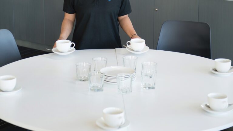 Image of a function table with tea cups and glasses.