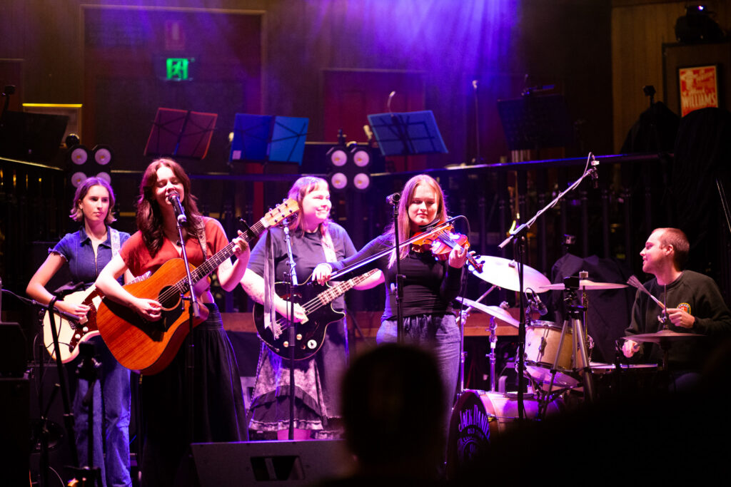 An image of Sofia Cirino performing with their band.